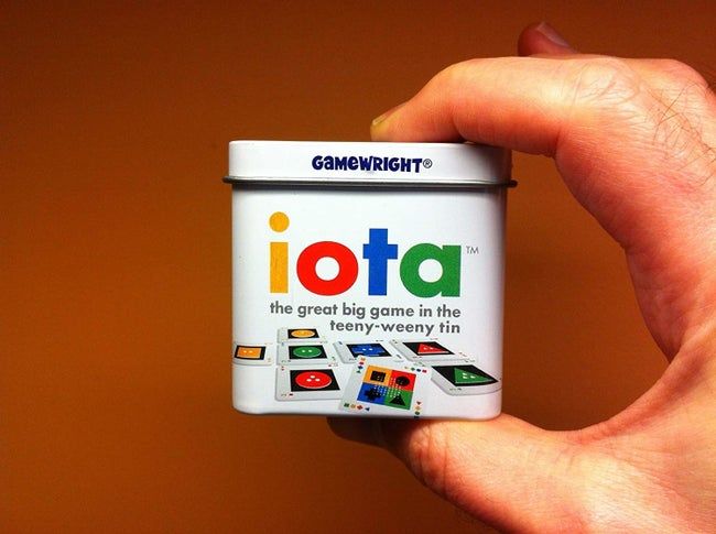 A tiny tin labeled 'Iota,' containing the puzzle game.
