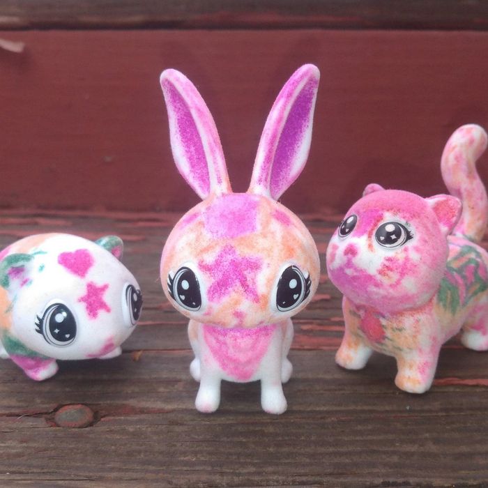 A photo from a reviewer showing three animal figures they've colored in.