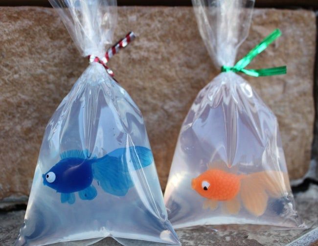 Two soaps in bags, each containing a plastic goldfish inside.