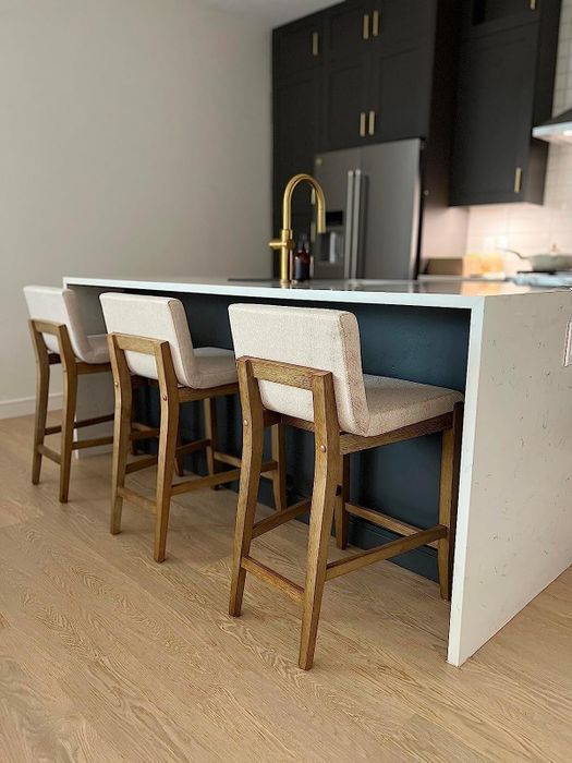 reviewer image showing three of the barstools around a kitchen counter