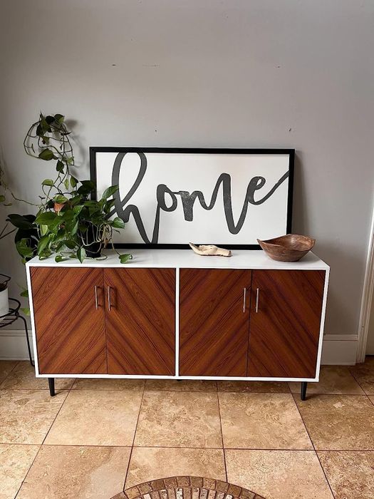reviewer image of the white double-door buffet placed in an entryway