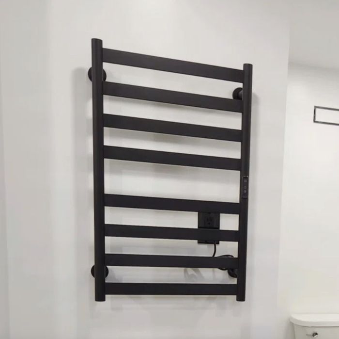 A reviewer’s towel warmer rack, adding a touch of comfort and luxury to any bathroom.