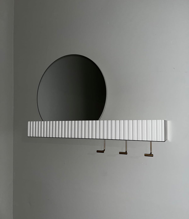 reviewer's photo showing the mirror and shelf mounted on a wall