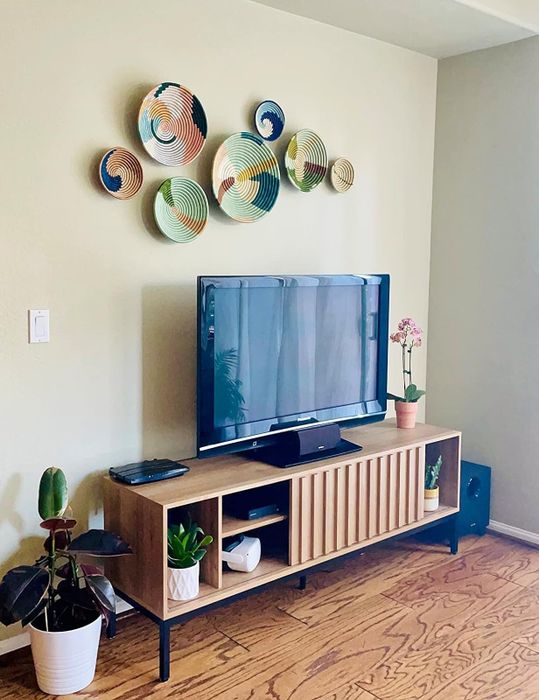 An image of the TV console set up in a cozy living room