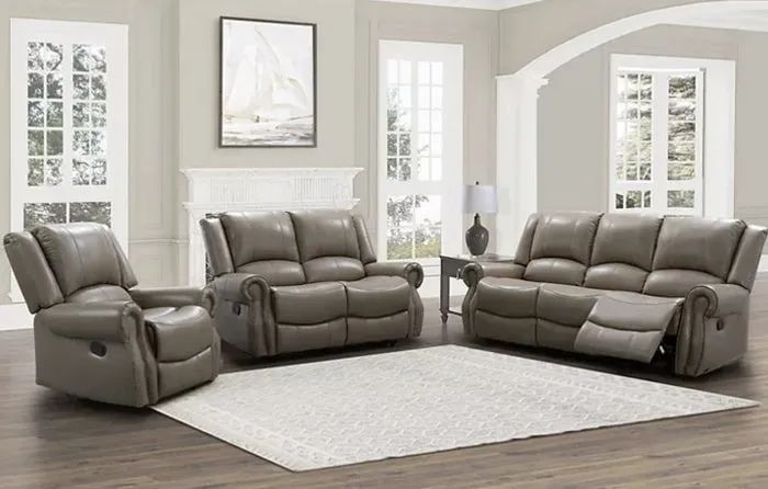 A beige three-piece furniture set beautifully arranged in a cozy living room.