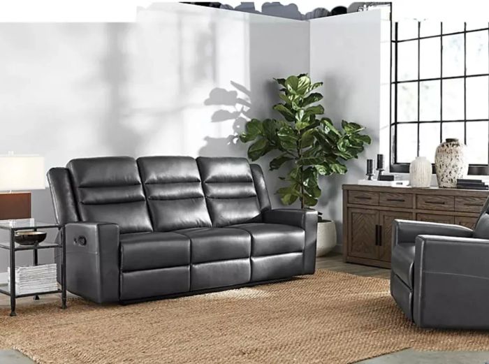 A reclining leather sofa in black, offering ultimate comfort and style.