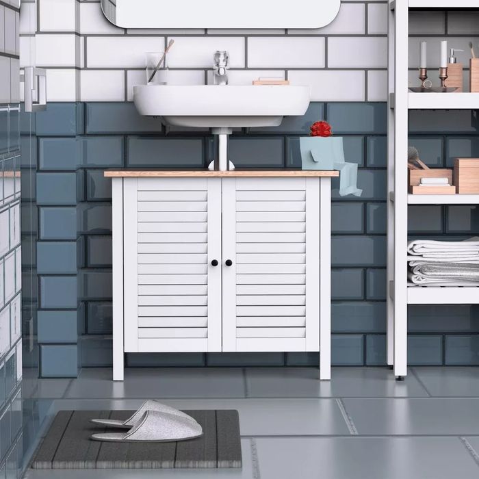 The under-sink storage cabinet neatly placed in a bathroom, showcasing its practicality and elegance.
