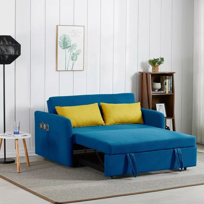 The trundle-style sleeper sofa unfolded, transformed into a bed