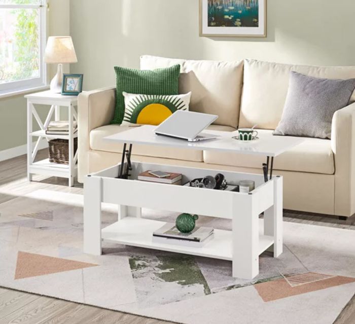 A white coffee table that seamlessly doubles as a lift-top desk, making it an ideal solution for small spaces.