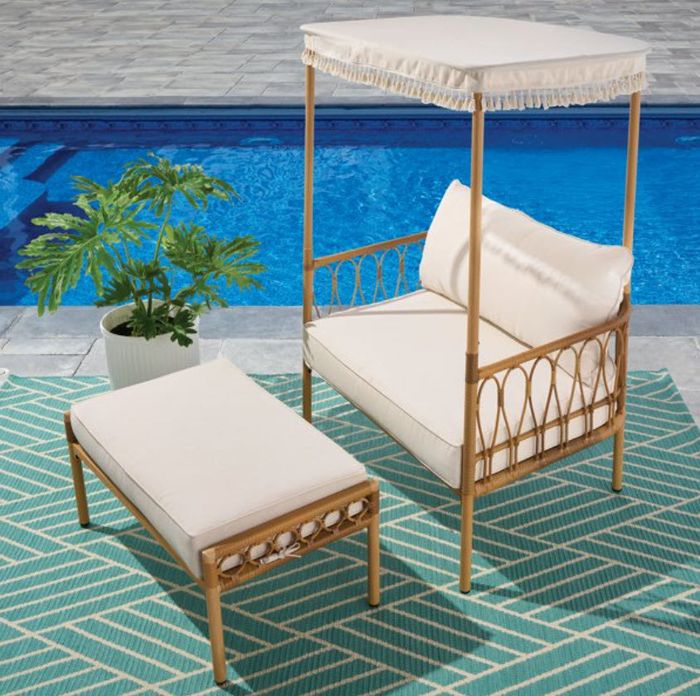 A two-piece canopy set featuring a cushioned seat with an awning and a separate footrest for extra comfort.