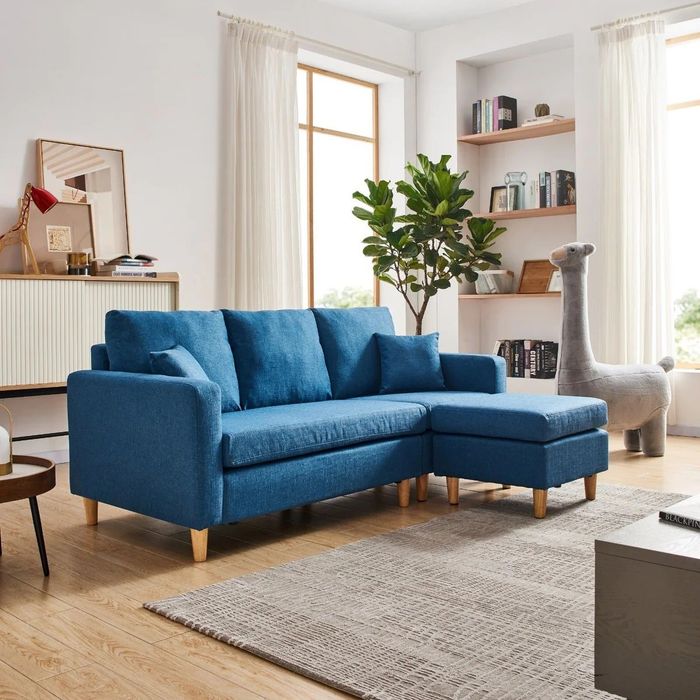 A blue sectional set in a cozy living room.