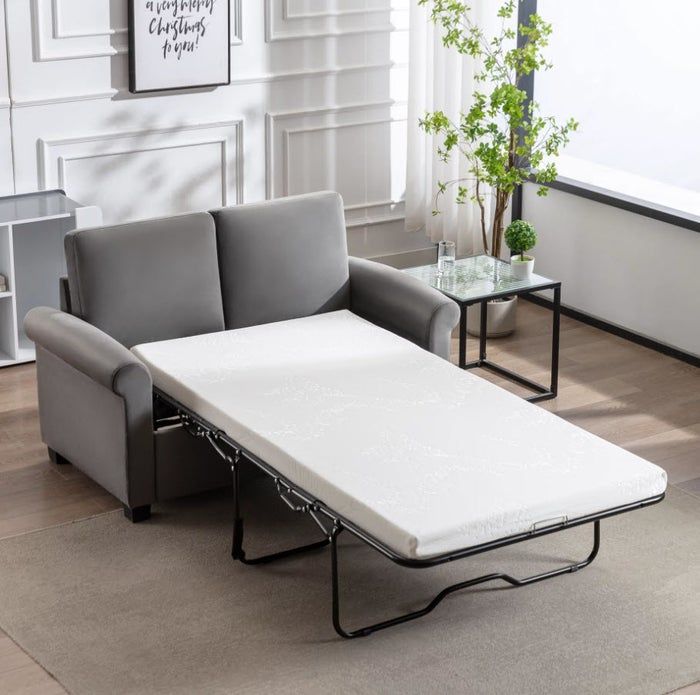compact grey sofa with a pull-out twin bed