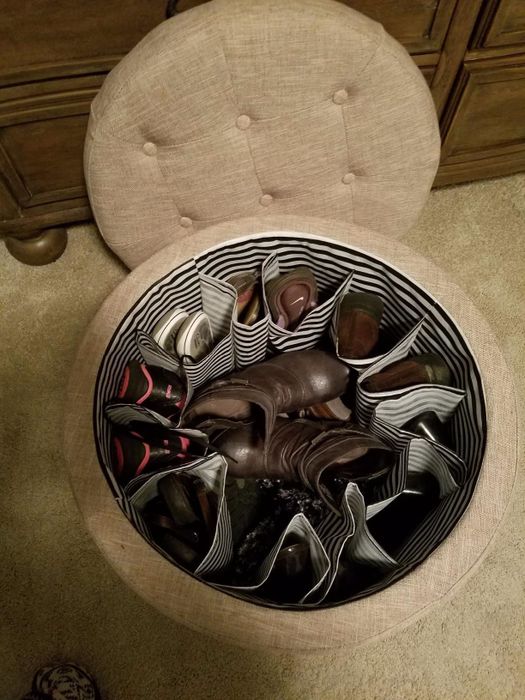 A reviewer’s image showing the open ottoman with shoes neatly stored inside.