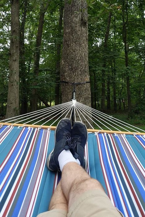 A reviewer’s legs resting comfortably in the hammock.