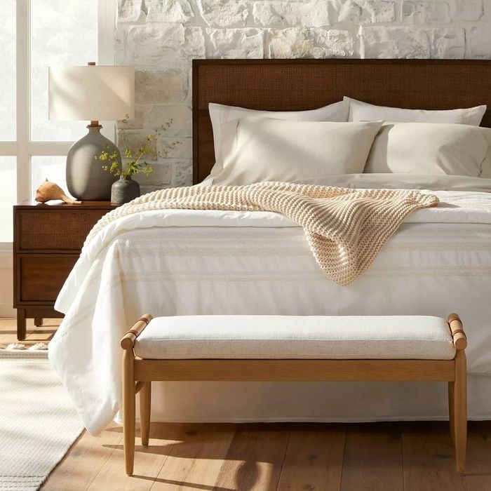 The accent bench positioned at the foot of a bed.