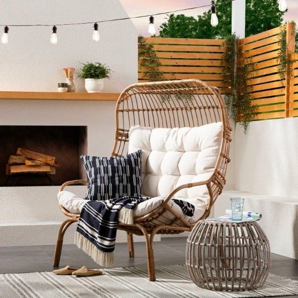 The chair accessorized with a pillow and blanket.