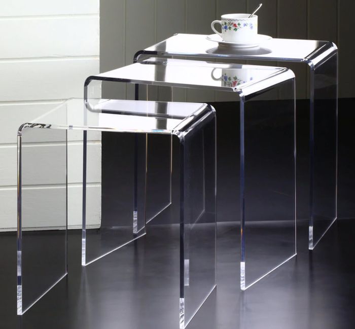 A set of three stylish glass nesting side tables, perfect for adding a modern touch to your living space.