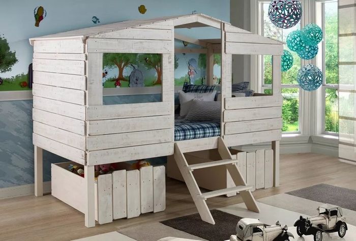 The treehouse bed displayed in a child's cozy bedroom.