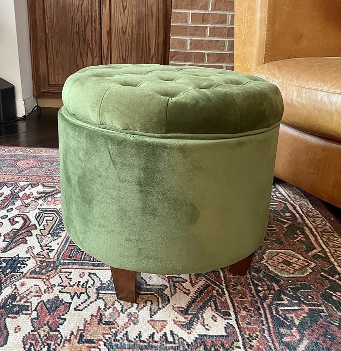 The ottoman in a vibrant green color, adding a fresh pop to the room.