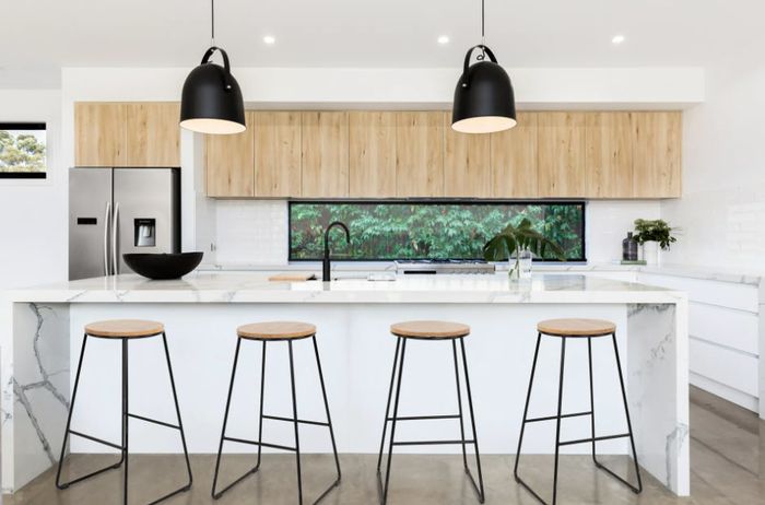 four black steel stools with wooden seat tops