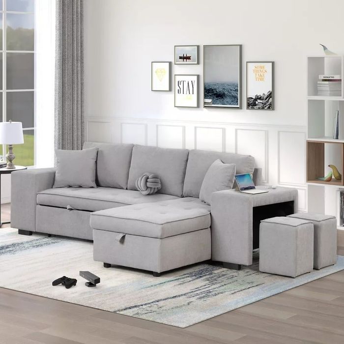 the sleeper sofa with two stools and a chaise lounge