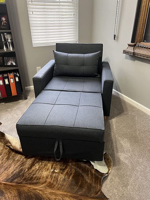 The navy chair extended to its full length as shown by the reviewer.
