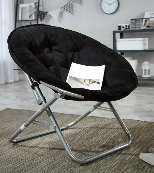 A chic black velvet foldable saucer chair with sleek metal legs for both comfort and style.