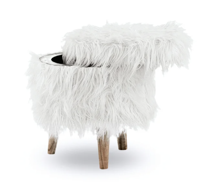 The super-soft white faux fur storage ottoman, with the lid slightly lifted off.