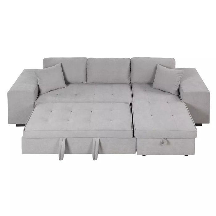 the sleeper sofa with a chaise lounge converted into a bed
