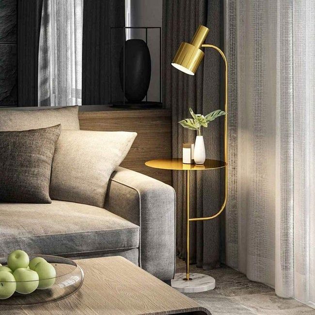 A lamp positioned next to a sofa