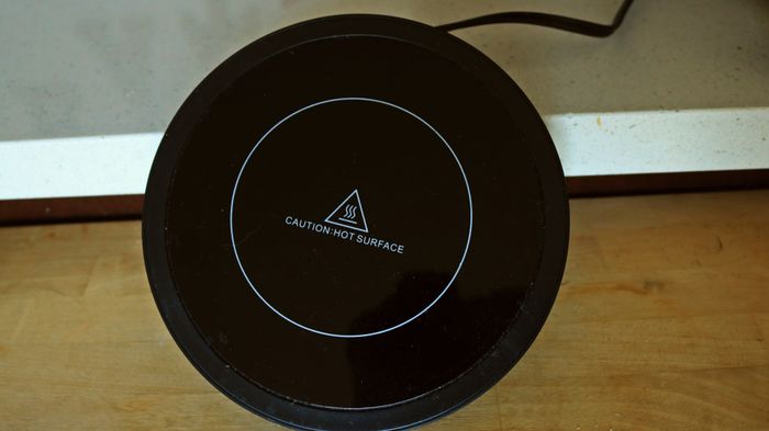A coffee mug warmer resting on the countertop can serve multiple purposes.