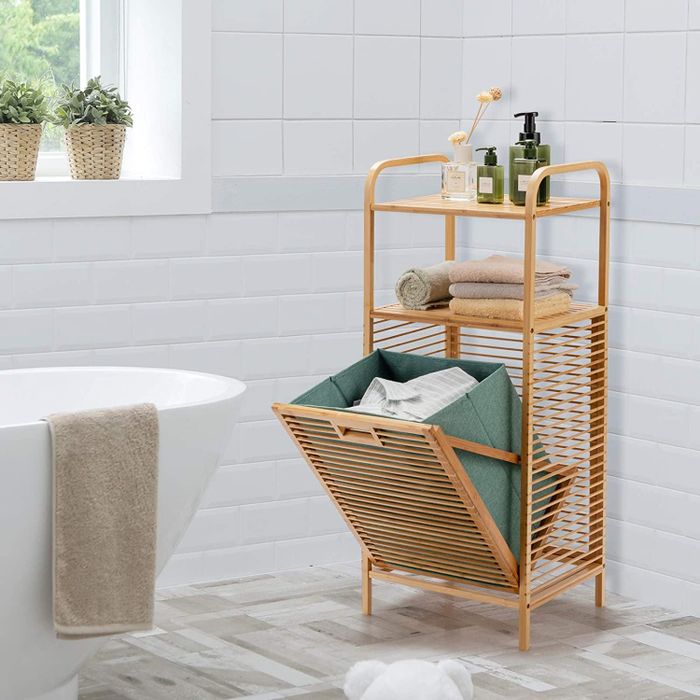 The same bamboo shelf with the hamper compartment open.