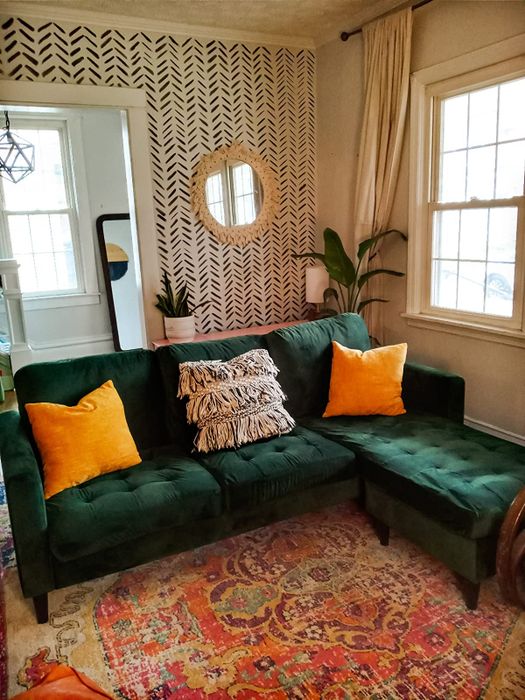 A reviewer’s photo showcasing the green L-shaped couch.