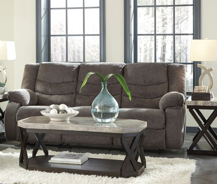 A gray reclining sofa set up in the living room, offering both style and relaxation.