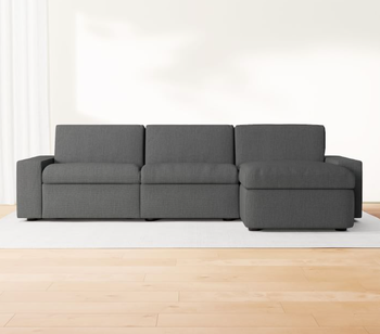 A lifestyle photo of a gray West Elm sectional couch.