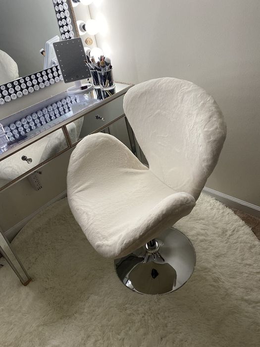 Reviewer image of a white fuzzy chair with a silver stand positioned in front of a white desk.
