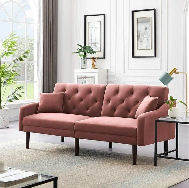 A pink sofa set in a refined living room, seamlessly blending style and comfort in a beautifully designed space.