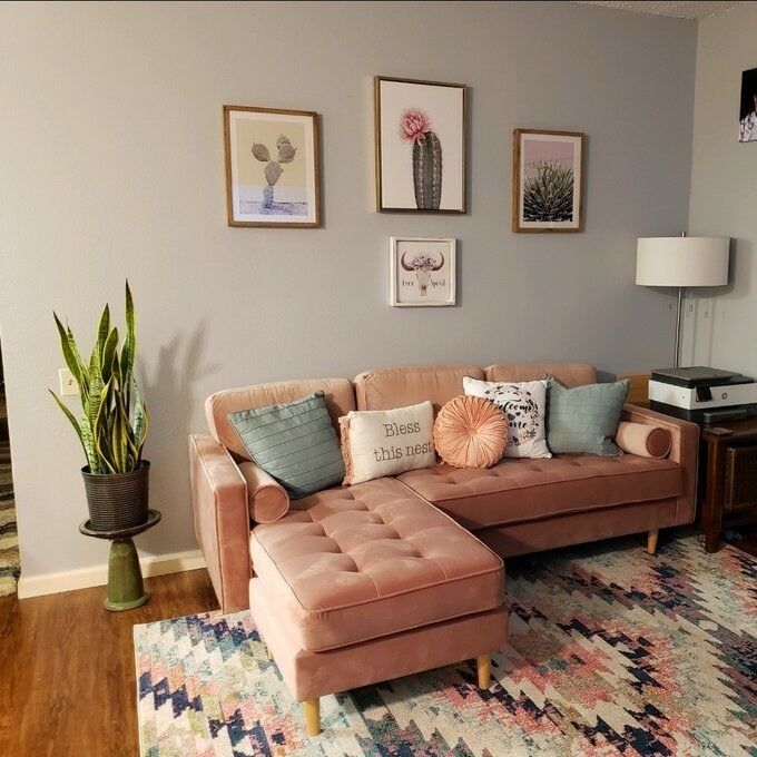 A reviewer’s photo showing the couch in soft pink, nestled in a beautifully styled room.