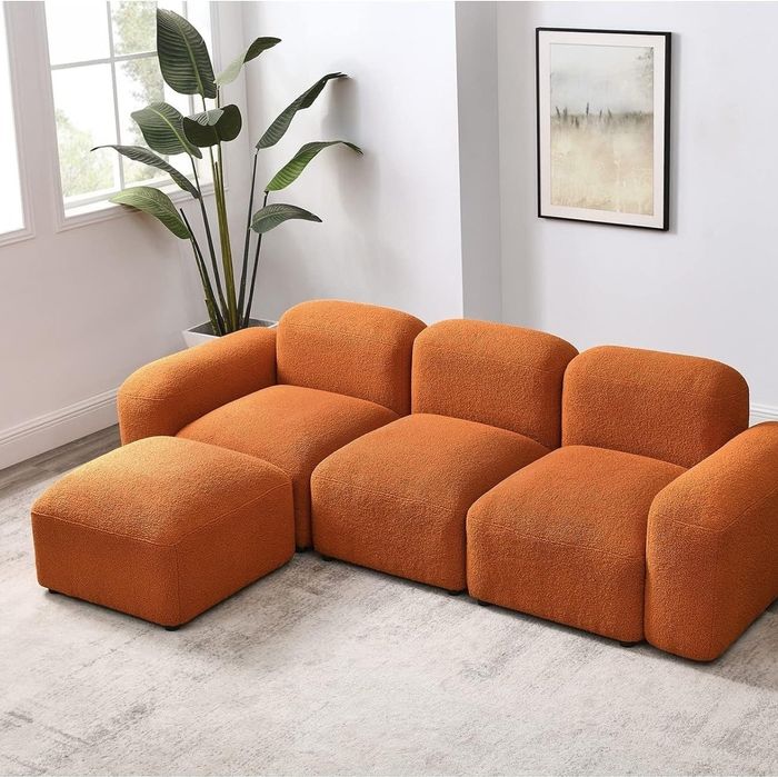 The vibrant orange couch.