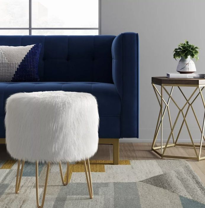 The fluffy white shaggy stool