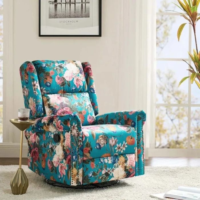 A floral-patterned recliner chair in a warm living room arrangement, complemented by a plant and framed artwork