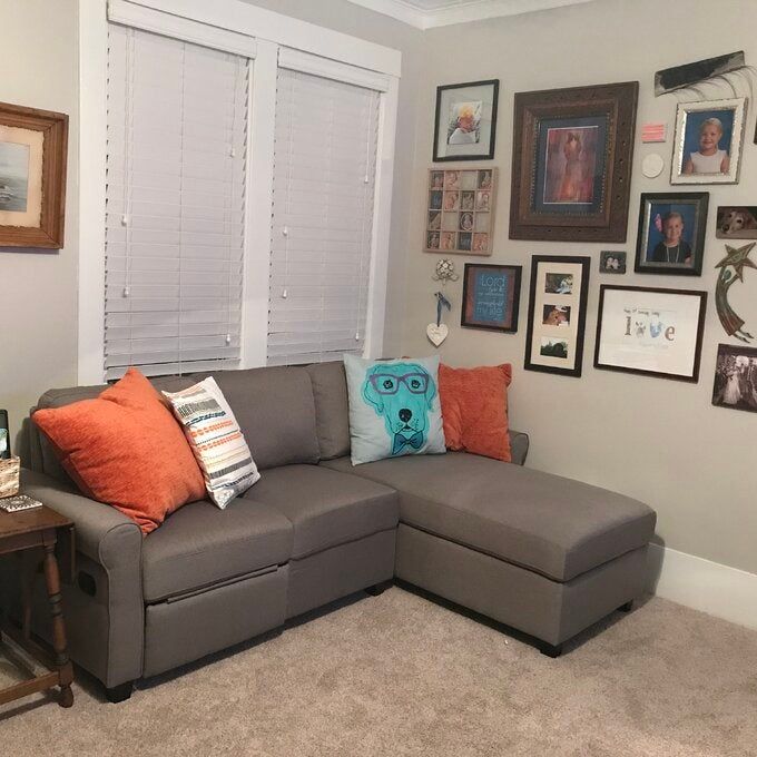 A reviewer’s photo of a gray sectional couch.