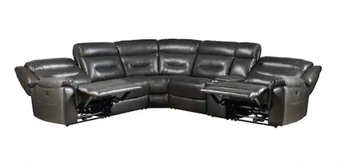 Another lifestyle image showcasing a black faux leather reclining sofa.