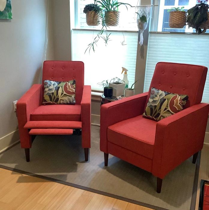A pair of muted orange recliners from a reviewer, one upright and the other fully reclined