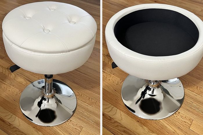 A close-up shot of the product placed on a hardwood floor, with the lid removed and the storage compartment empty.
