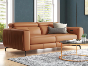 A caramel-colored leather sofa, exuding warmth and comfort.
