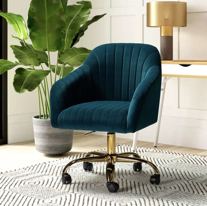 The deep teal chair with a gold base and smooth caster wheels