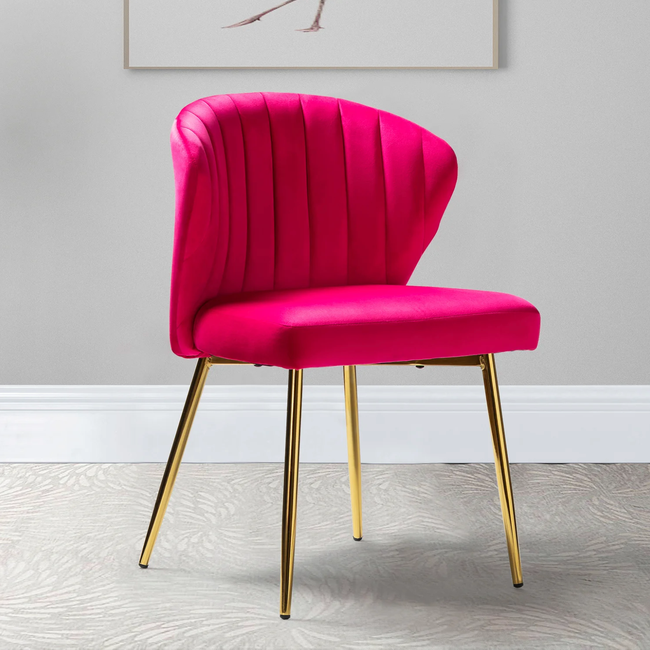Bright hot pink armless chair with four golden legs set on a gray swirl carpet in front of a gray wall.
