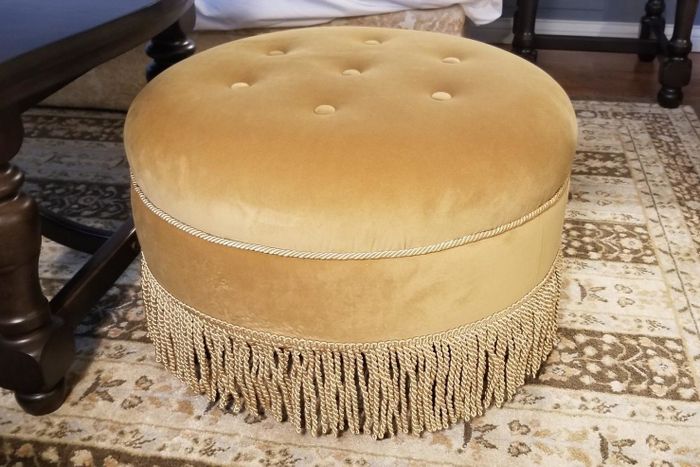 The reviewer's gold ottoman is shown.