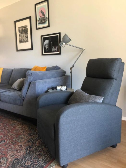 a reviewer's dark gray recliner shown in an upright position